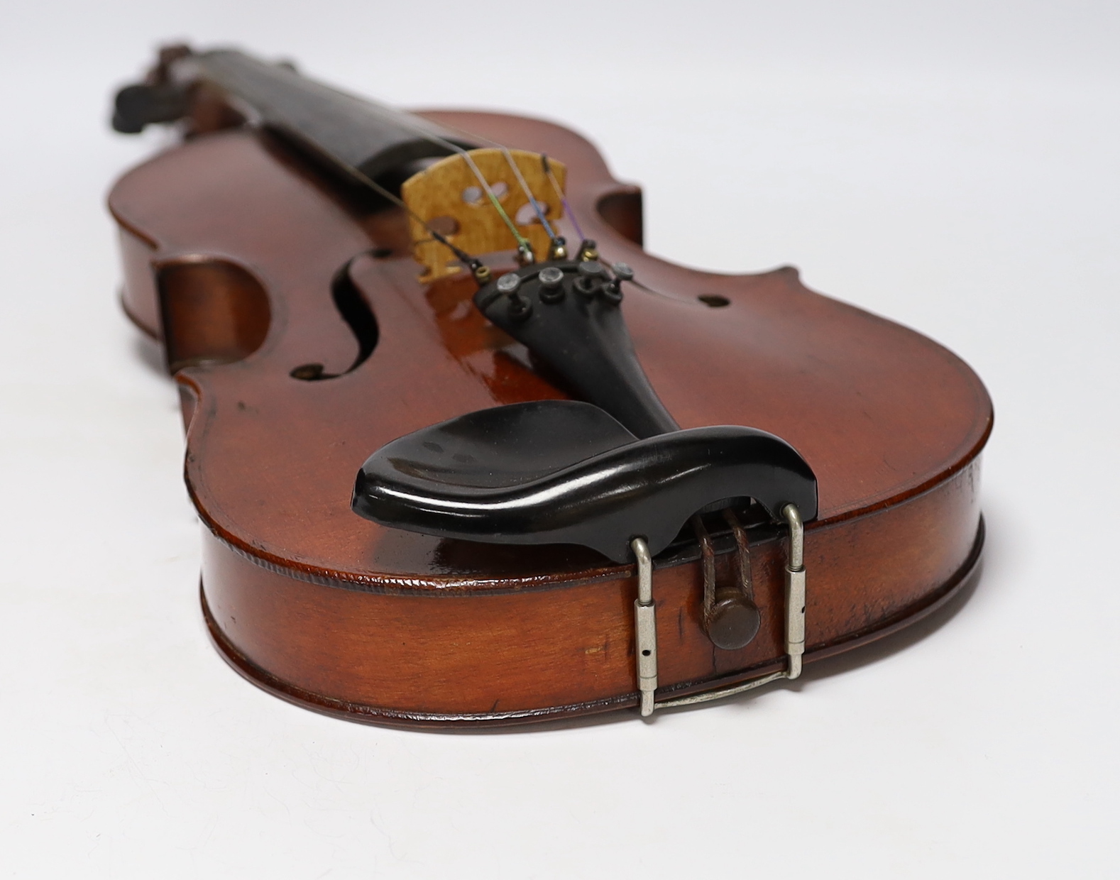A wooden cased student violin